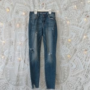 Rockstar Mid rise holy jeans